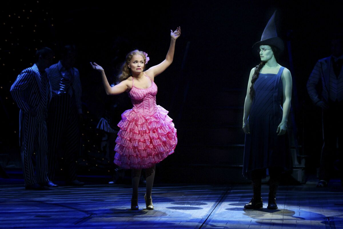 Kristin Chenowth, left, as Glinda the Good Witch and Idina Menzel as Elphaba 