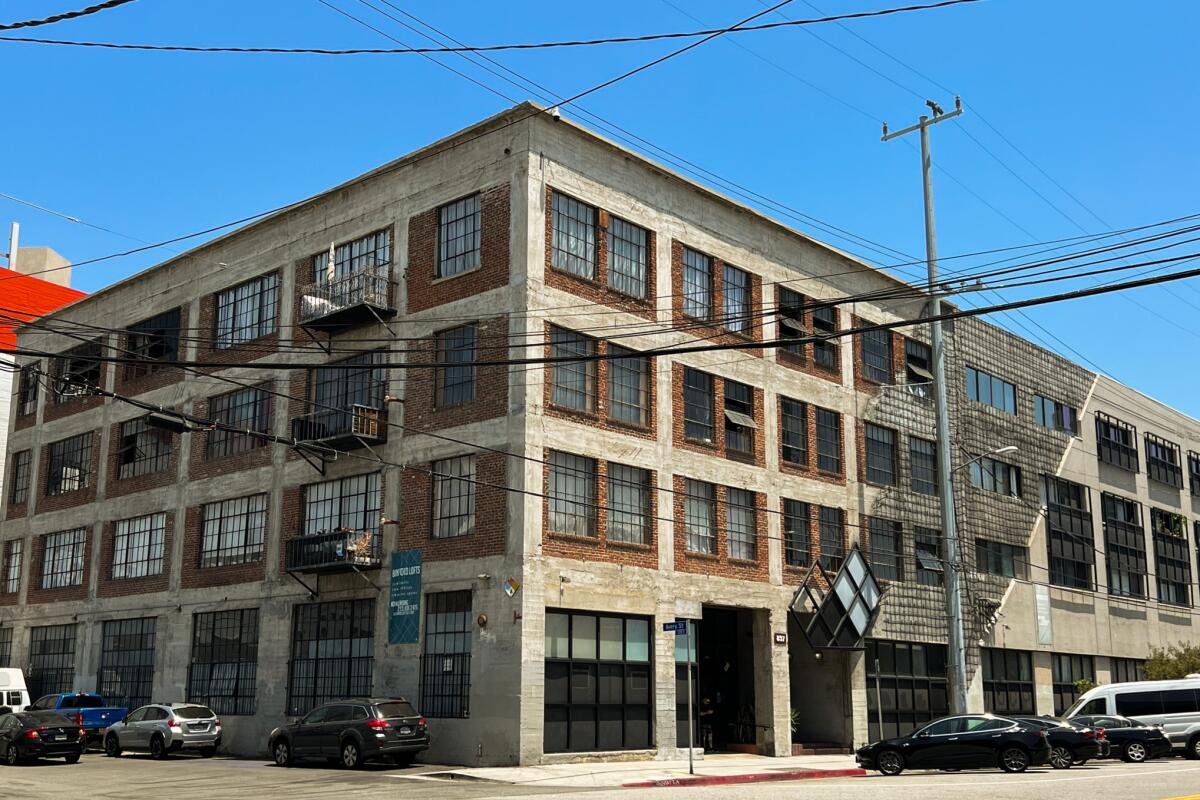 A multistory industrial building turned loft complex.