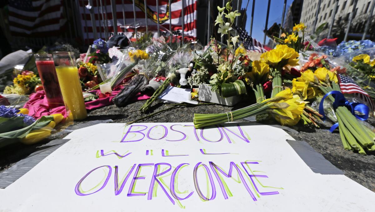 Photograph, flowers, signs left after 2013 Boston Marathon bombing