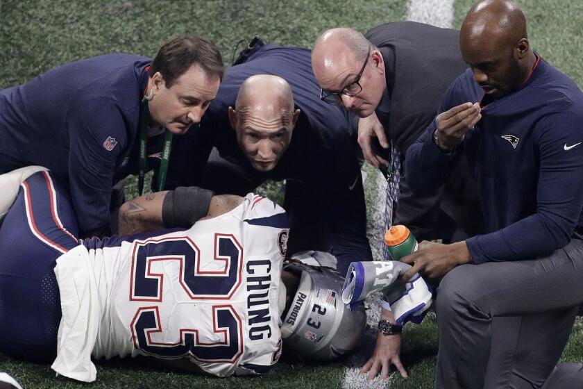 New England Patriots' Patrick Chung (23) is helped by medical staff after an injury during the second half of the NFL Super Bowl 53 football game against the Los Angeles Rams Sunday, Feb. 3, 2019, in Atlanta. (AP Photo/Charlie Riedel)