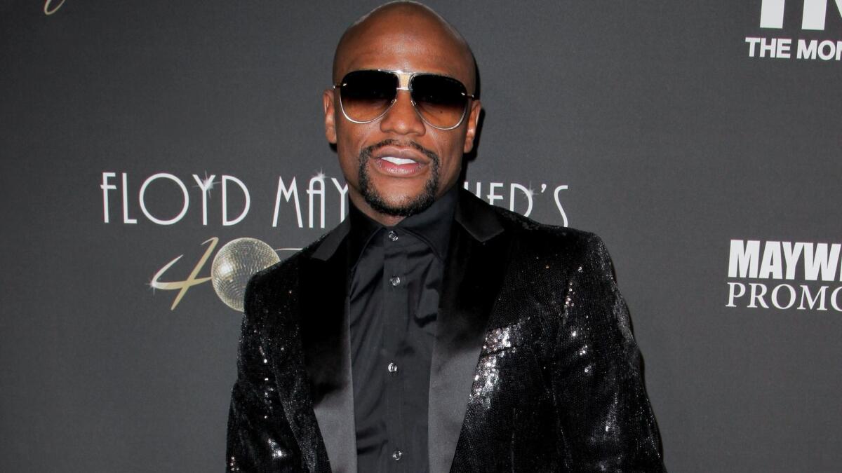 Floyd Mayweather poses prior to his 40th birthday celebration Feb. 25 in Los Angeles.