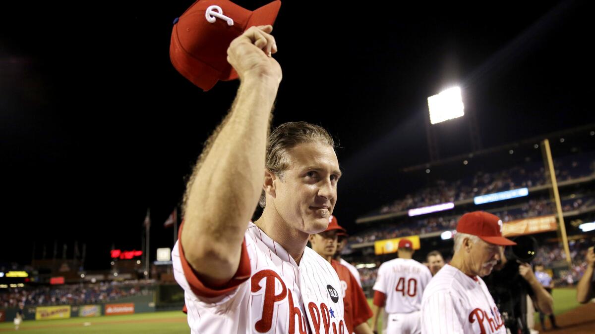 Chase Utley acknowledges cheers from the Phillies fans after a 7-4 victory over the Blue Jays in Philadelphia on Wednesday, his final game with the team.