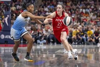Indiana Fever guard Caitlin Clark (22) makes a move around the defense of Chicago Sky guard Lindsay Allen, left, during a WNBA basketball game Saturday, June 1, 2024, in Indianapolis. (AP Photo/Doug McSchooler)