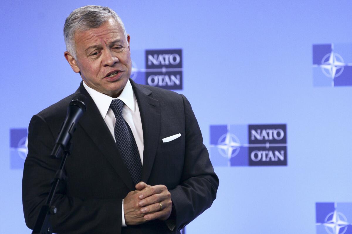 FILE - Jordan's King Abdullah II speaks during a media conference prior to a meeting with NATO Secretary General Jens Stoltenberg at NATO headquarters in Brussels, in this Wednesday, May 5, 2021, file photo. Hundreds of world leaders, powerful politicians, billionaires, celebrities, religious leaders and drug dealers have been stashing away their investments in mansions, exclusive beachfront property, yachts and other assets for the past quarter century, according to a review of nearly 12 million files obtained from 14 different firms located around the world. The report released Sunday, Oct. 3, 2021, by the International Consortium of Investigative Journalists involved 600 journalists from 150 media outlets in 117 countries. Jordan's King Abdullah II is one of 330 current and former politicians identified as beneficiaries of the secret accounts. (Johanna Geron, Pool via AP, File)