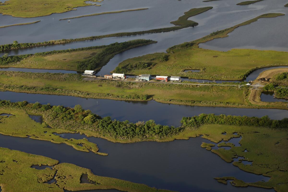 At the southern end of Isle of Jean Charles are "fish camps," used for recreational purposes. (Carolyn Cole / Los Angeles Times)