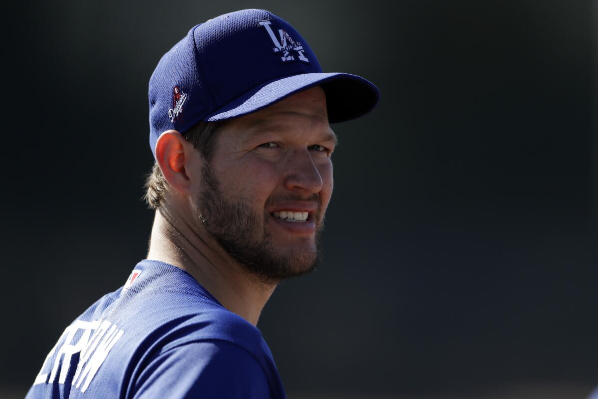 Dodgers pitcher Clayton Kershaw looks on at spring training.