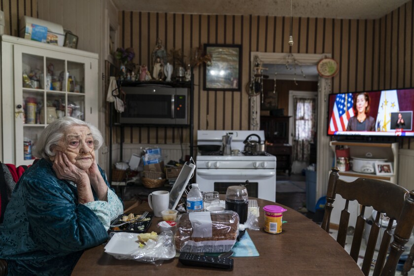 Rita Scanlon, 92, eats lunch delivered to her by Meals on Wheels.