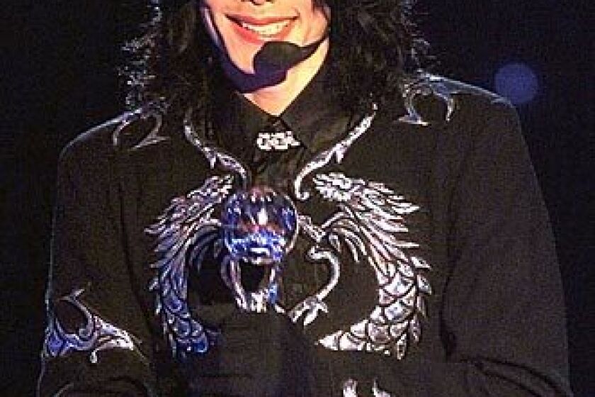 Michael Jackson holds the Millennium Award at a ceremony in May 2000 in Monaco.