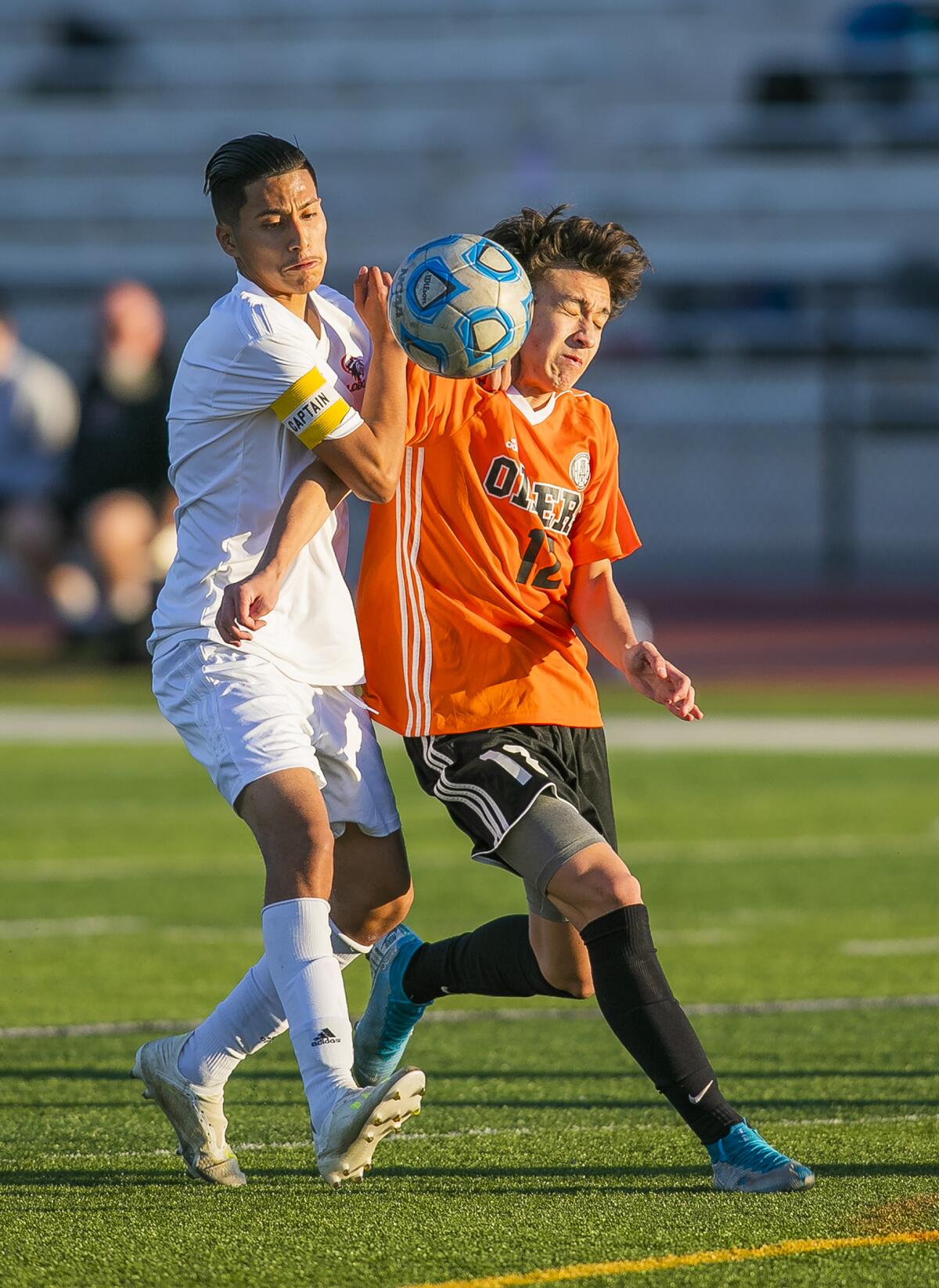 Los Amigos's Allen Ocampo battles with Huntington Beach's Carson Dykes.