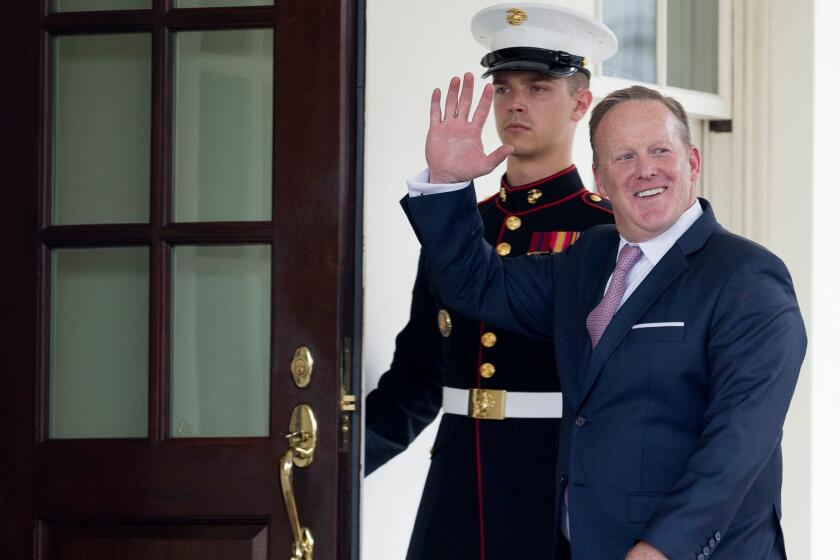 epaselect epa06102635 Outgoing White House Press Secretary Sean Spicer (R) waves beside a US Marine as he enters the West Wing of the White House in Washington, DC, USA, 21 July 2017. Sarah Huckabee Sanders replaces Sean Spicer as White House Press Secretary after Spicer resigned following US President Donald J. Trump's decision to appoint Anthony Scaramucci as White House Communications Director. EPA/MICHAEL REYNOLDS ** Usable by LA, CT and MoD ONLY **