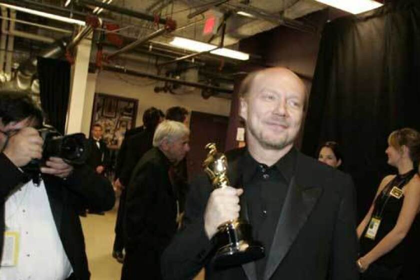 Paul Haggis is shown backstage at the Kodak Theatre in this 2006 photo after "Million Dollar Baby," for which he wrote the screenplay, won the Oscar for best picture.