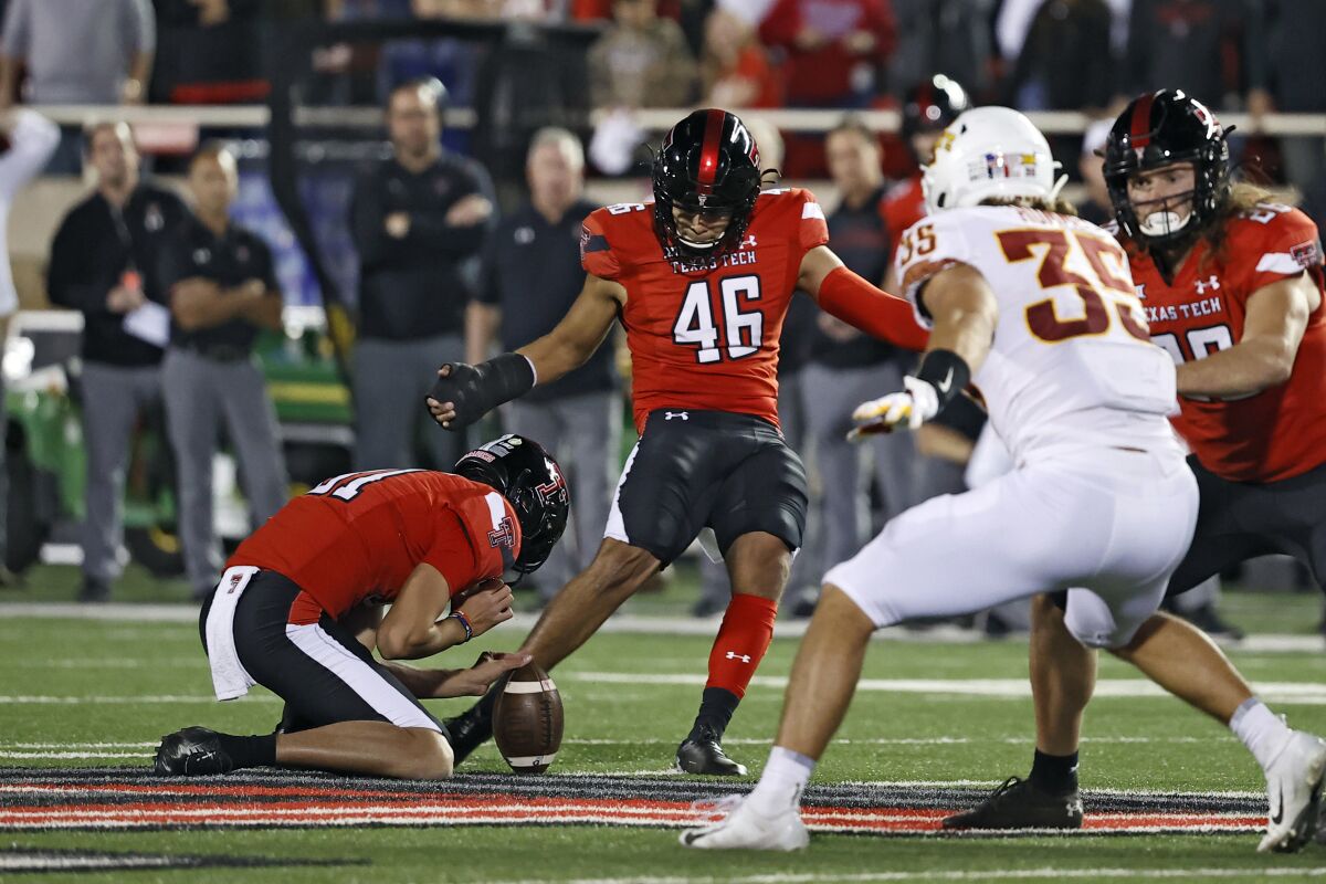 Texas Tech's Jonathan Garibay (46) kicks the game-winning 62-yard field goal during the second half of an NCAA college football game against Iowa State, Saturday, Nov. 13, 2021, in Lubbock, Texas. (AP Photo/Brad Tollefson)
