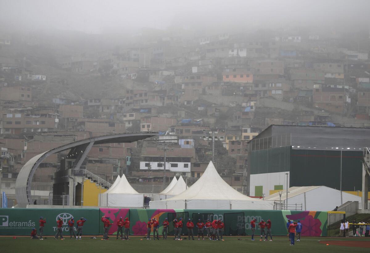 Members of Puerto Rico's national baseball team practice at the Villa Maria del Triunfo sports complex in Lima, Peru, Wednesday, July 24, 2019. The Pan American Games begin July 26 and run through Aug. 11. (AP Photo/Fernando Llano)