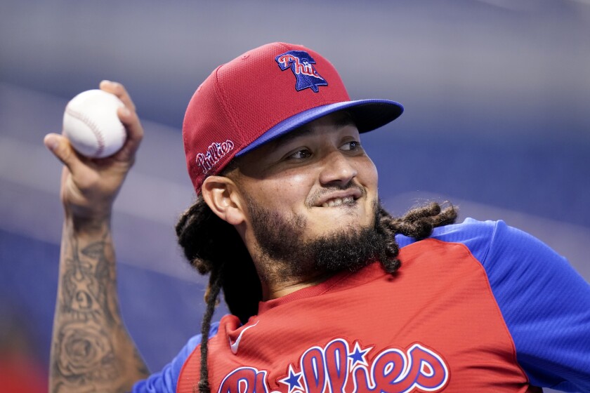 FILE - Philadelphia Phillies' Freddy Galvis warms up before a baseball game against the Miami Marlins, Friday, Oct. 1, 2021, in Miami. The veteran infielder Galvis has signed a two-year deal with the Fukuoka SoftBank Hawks of Japanese baseball. (AP Photo/Lynne Sladky, File)