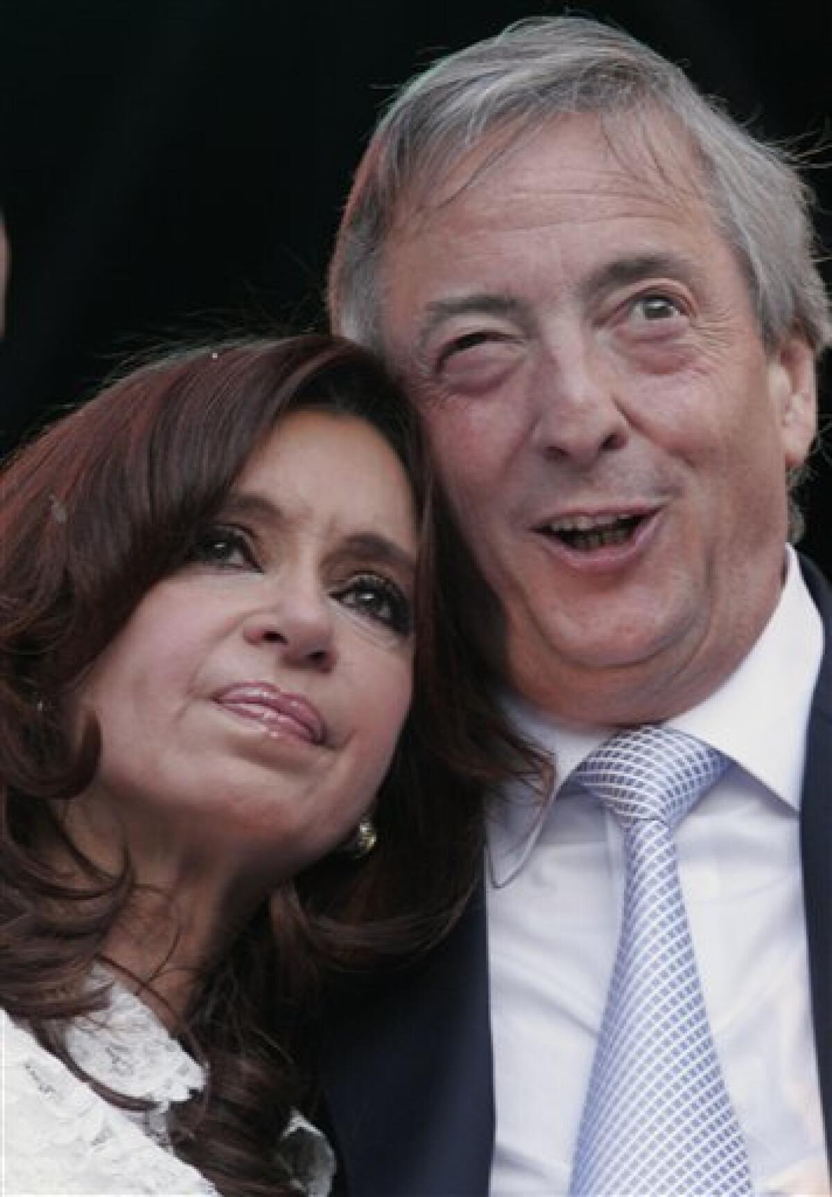 FILE - In this Dec. 10, 2007 file photo, Argentina's departing president Nestor Kirchner, right, embraces his wife, Argentina's new president Cristina Fernandez, during a music festival in front of the presidential palace in Buenos Aires, Argentina. According to state television in Argentina, Nestor Kirchner died on Wednesday Oct. 27, 2010 of a heart attack at age 60. (AP Photo/Jorge Saenz, File)