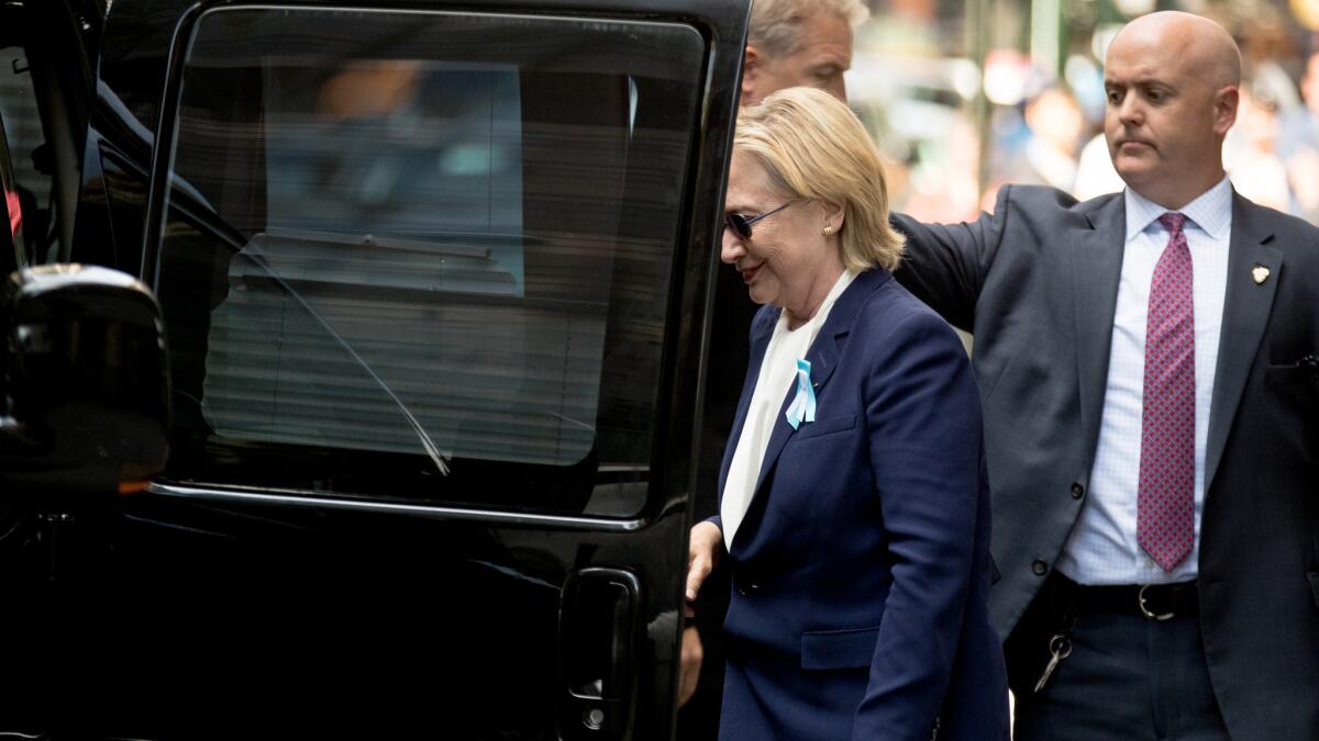 Hillary Clinton gets into a van as she departs a New York apartment building on Sept. 11. Clinton's campaign said the Democratic presidential nominee left a 9/11 anniversary ceremony in New York early after feeling "overheated."