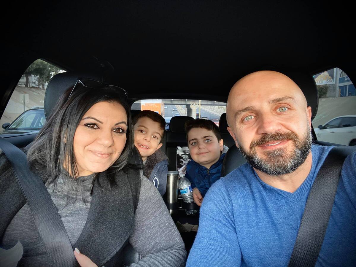 The Koroghlyan family in a vehicle