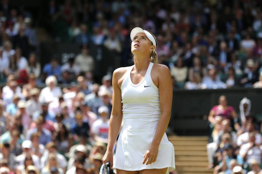 Maria Sharapova looks up after losing a point to Angelique Kerber during their match Tuesday at Wimbledon.