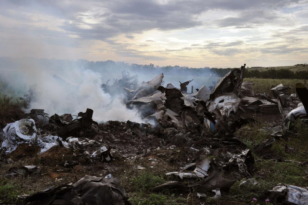 The wreckage of a Ukrainian AN-26 military transport plane after it was shot down July 14 by a missile in the Luhansk region. Ukraine has accused Russia of this earlier incident and the downing July 16 of a Ukrainian Su-24 jet.