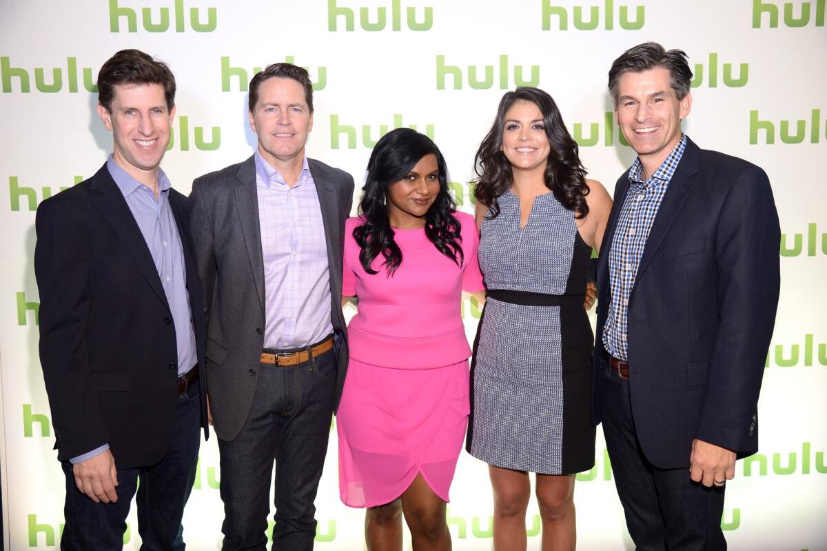 From left, Craig Erwich, Peter Naylor, Mindy Kaling, Cecily Strong and Mike Hopkins attend Hulu's Upfront Presentation in New York City.