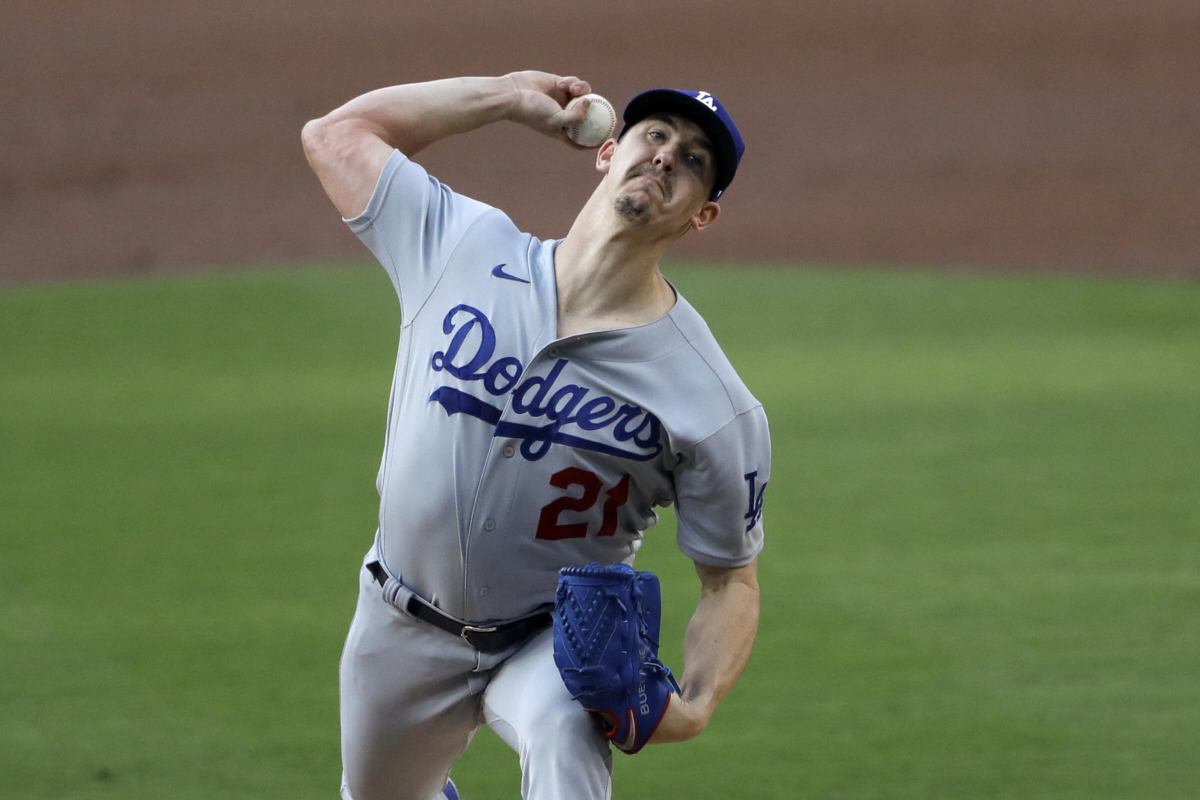 Los Angeles Dodgers starting pitcher Walker Buehler works against a San Diego Padres batter.