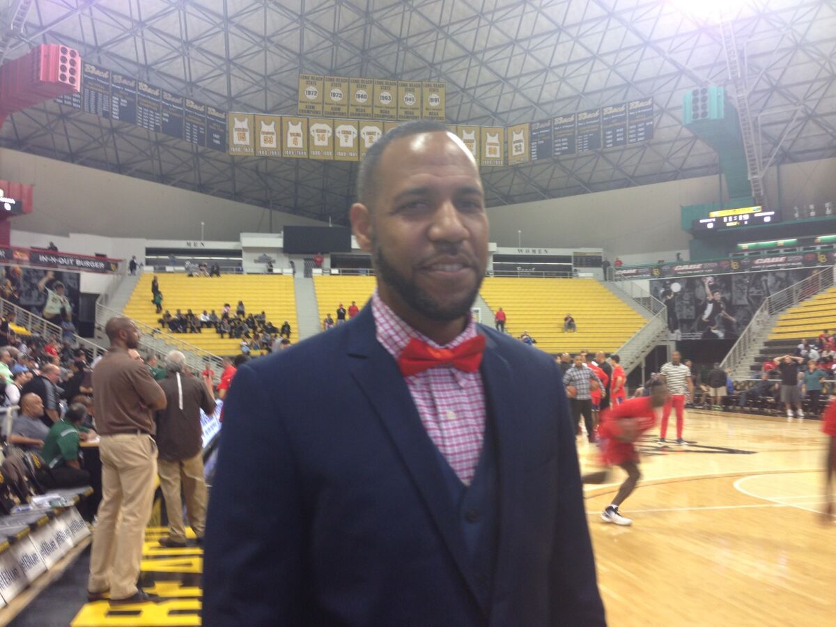 Reggie Morris Jr. won in his debut as Fairfax basketball coach.