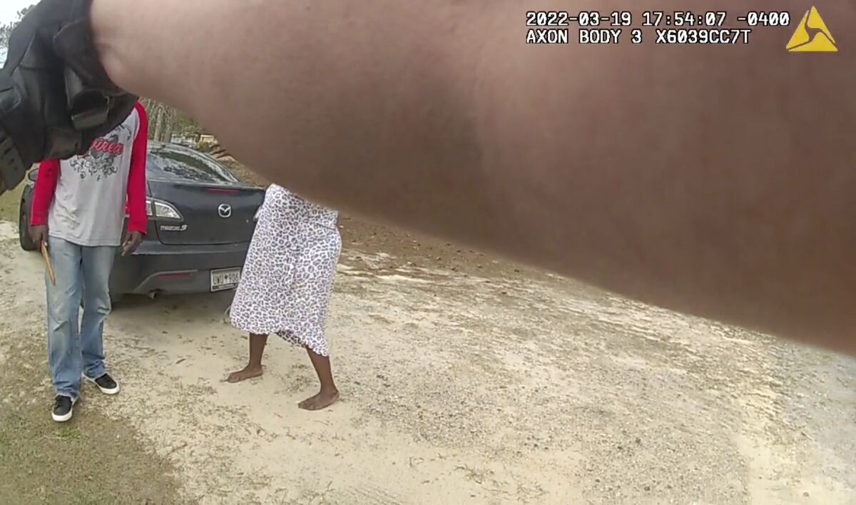 FILE - In this image from the body camera video of Richland County Sherrif's Deputy John Anderson, Irvin D. Moorer Charley holds a piece of wood as he walks towards Anderson, who is backpedaling, on March 19, 2022, in Columbia, S.C. A prosecutor in South Carolina decided Tuesday, June 14 not to charge Anderson and a fellow officer in the fatal shooting of the man who lunged at them after family members warned them the victim was mentally ill. (Deputy John Anderson/Richland County Sheriff's Department via AP, File)