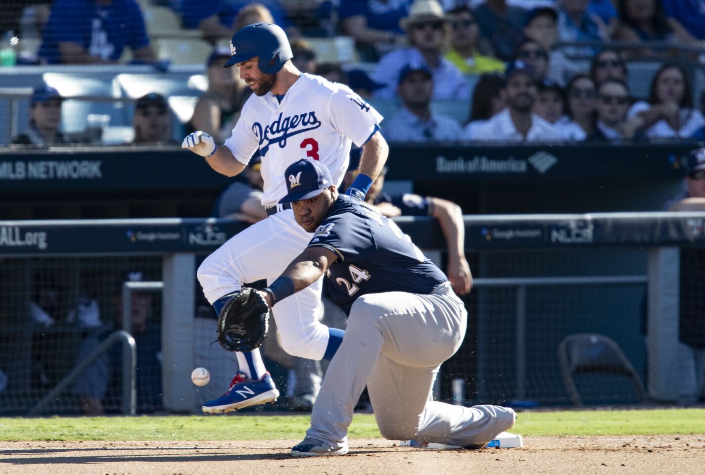 Dodgers center fielder Chris Taylor beats the throw to first base.