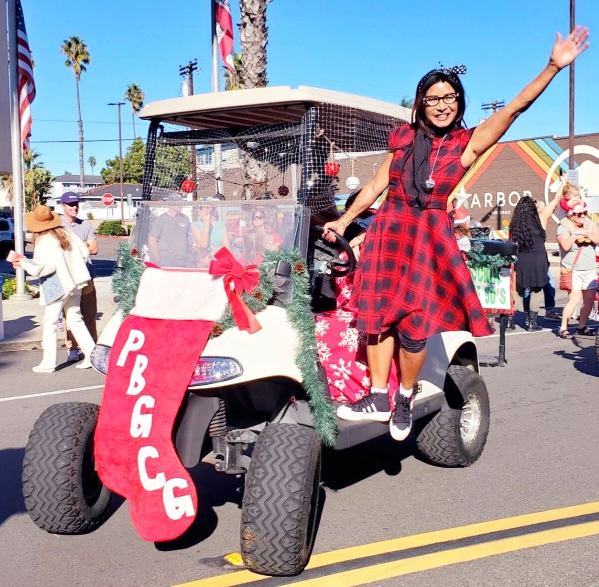 PB Golf Cart Gang founder Linda Rosas Townson leading the entry of golf carts during the 2021 PB Holiday Parade.