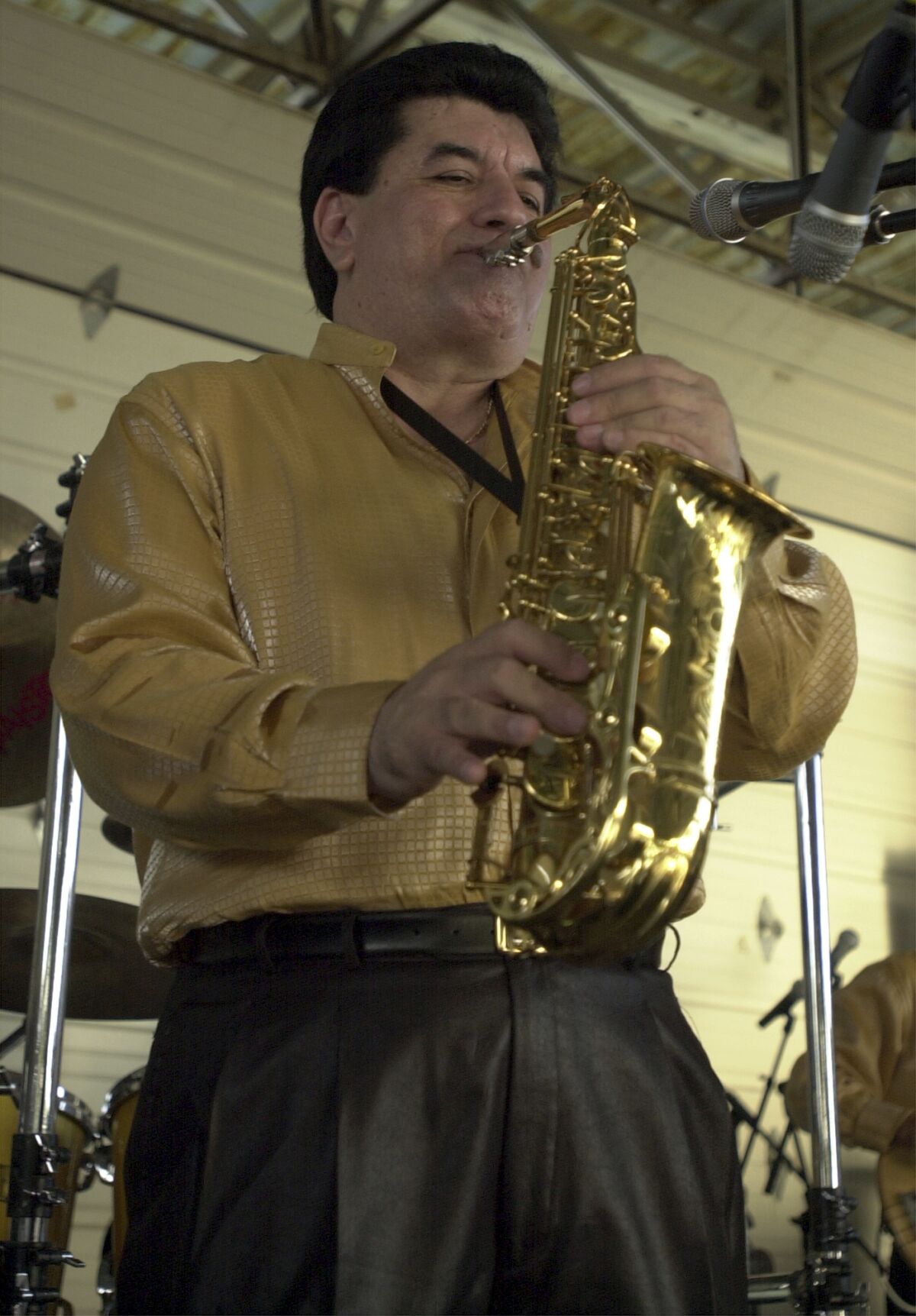 Fito Olivares performs during the Cinco de Mayo celebration held at Rosedale Park Sunday May 5, 2002 in San Antonio, Texas. Olivares, known for songs that were wedding and quinceanera mainstays including the hit “Juana La Cubana,” died Friday, March 17, 2023. He was 75. The noted saxophonist died in the morning at home in Houston, according to his wife, Griselda Olivares. (Edward A. Ornelas/The San Antonio Express-News via AP)