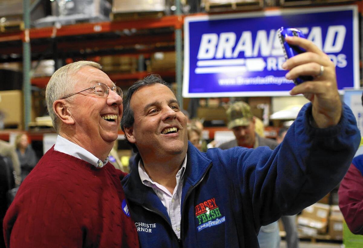Though the election isn't until 2016, presidential hopefuls are already strategizing. New Jersey Gov. Chris Christie takes a selfie with Dick Benne of Burlington, Iowa, after speaking at a get-out-the-vote rally in October.
