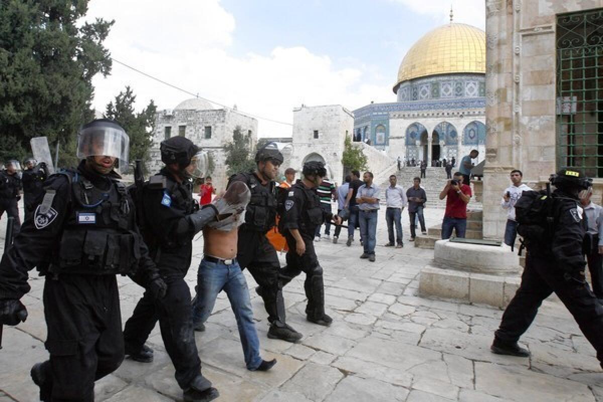 Israeli police arrest stone thrower at Dome of the Rock in Jerusalem.