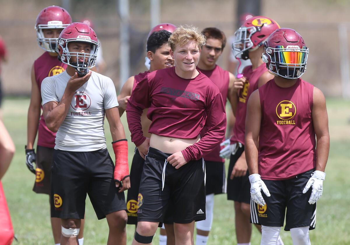 Jeremiah Davis, left, Lucas Pacheco and Beto Sotomayor wait for instructions during an Estancia practice on Aug. 7.