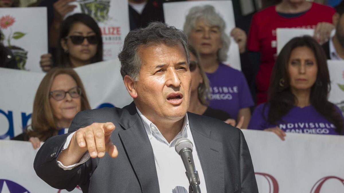 U.S. Rep. Juan Vargas speaks at Chicano Park on Monday to denounce President Trump's visit to San Diego.