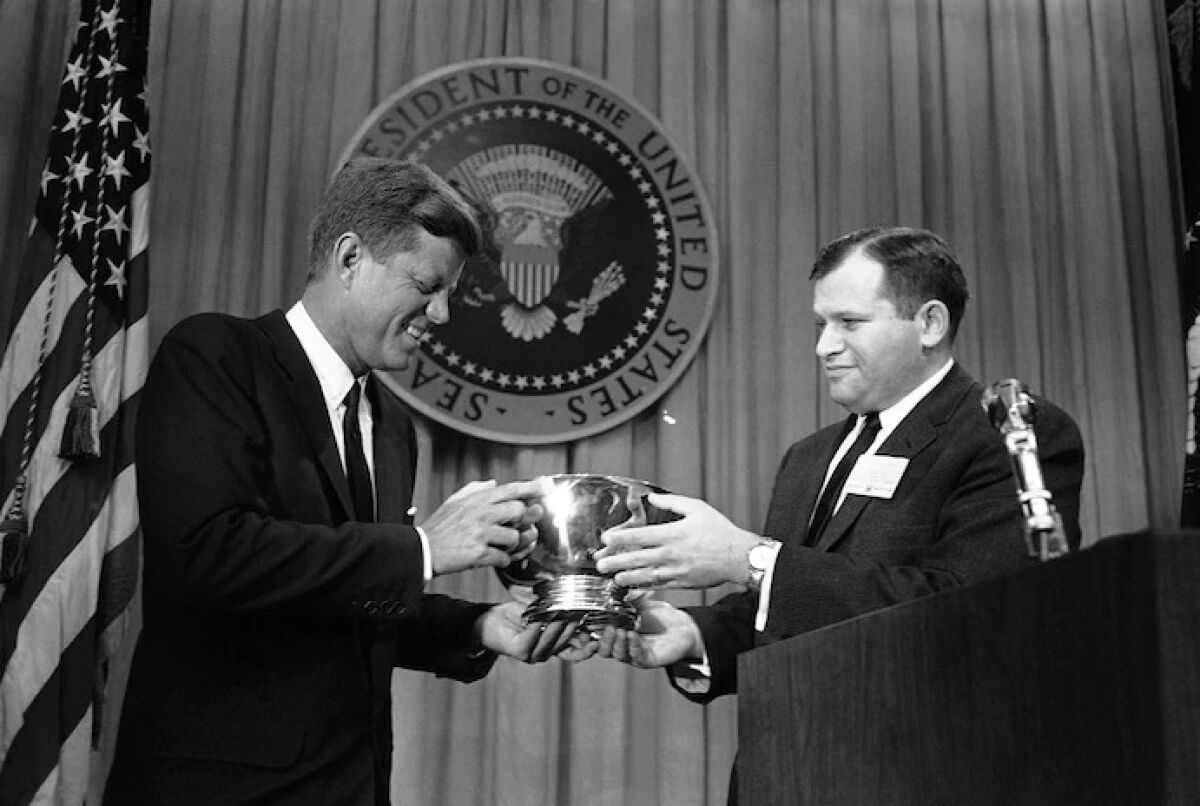 President Kennedy and William Small in 1962.