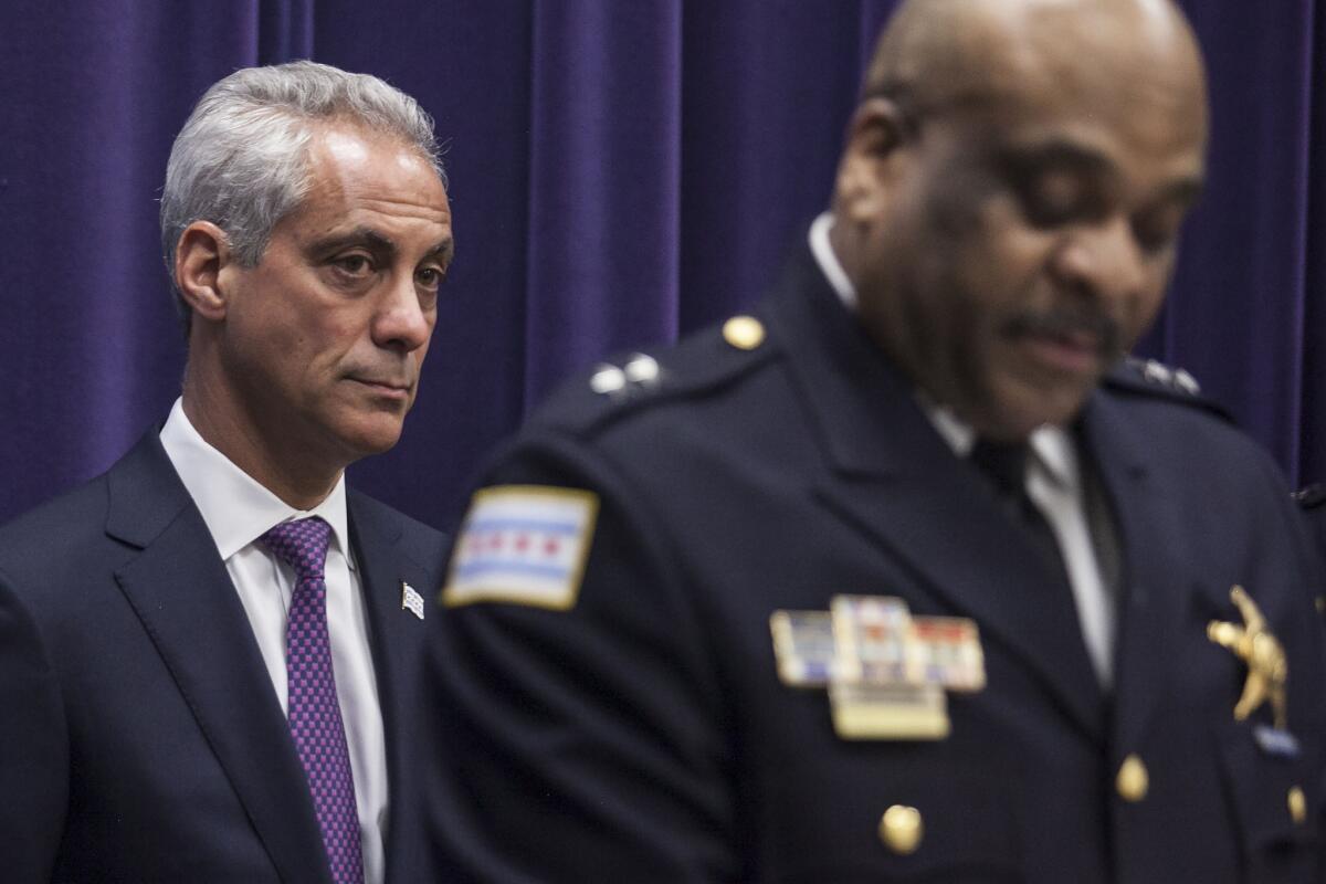 Chicago Mayor Rahm Emanuel looks on last month after announcing the appointment of Eddie Johnson, right, as interim superintendent of the Chicago Police Department. City officials are trying to spare Emanuel from having to testify at a trial involving two whistle-blower police officers.