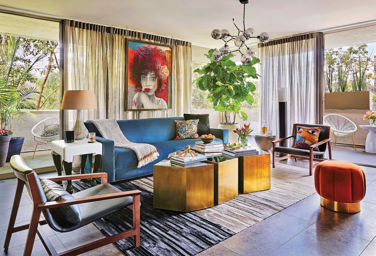 This room in designer John McClain's Hollywood Hills home is a neutral envelope for the blue velvet sofa. 