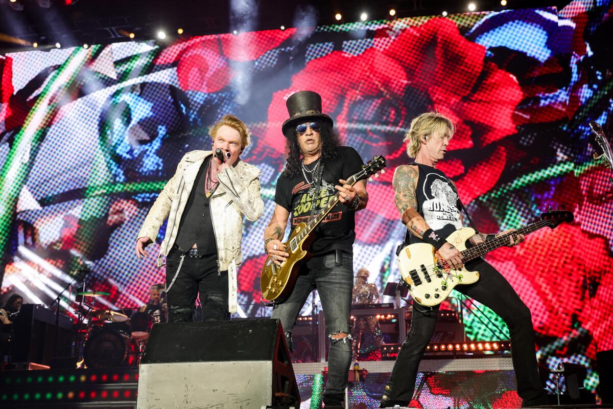 INDIO, CALIFORNIA - OCTOBER 06: (EDITORIAL USE ONLY) (L-R) Axl Rose, Slash, and Duff McKagan of Guns N' Roses perform onstage during the Power Trip music festival at Empire Polo Club on October 06, 2023 in Indio, California. (Photo by Kevin Mazur/Getty Images for Power Trip)