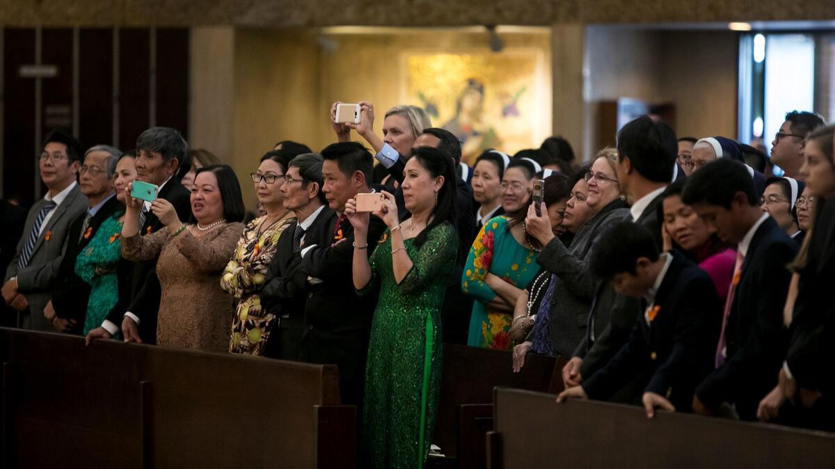 Parishioners attend the ordination of the Rev. Thomas Thanh Thai Nguyen as the auxiliary bishop of Diocese of Orange on Dec. 19.