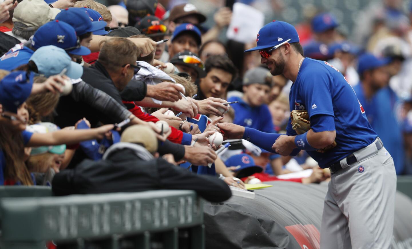 ubs third baseman Kris Bryant pauses to sign autographs for fans before facing the Rockies on Tuesday, May 9, 2017, in Denver.