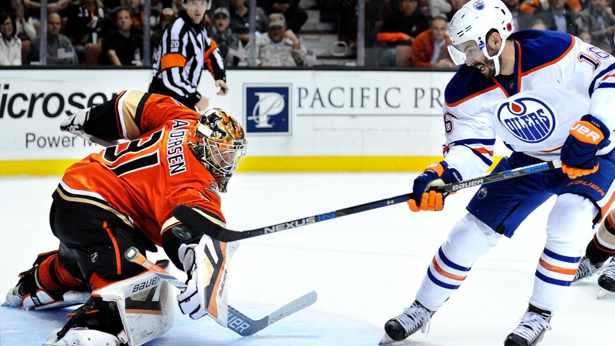 Oilers right wing Teddy Purcell scores the game-winning goal in overtime against Ducks goalie Frederik Andersen on Wednesday night at the Honda Center.