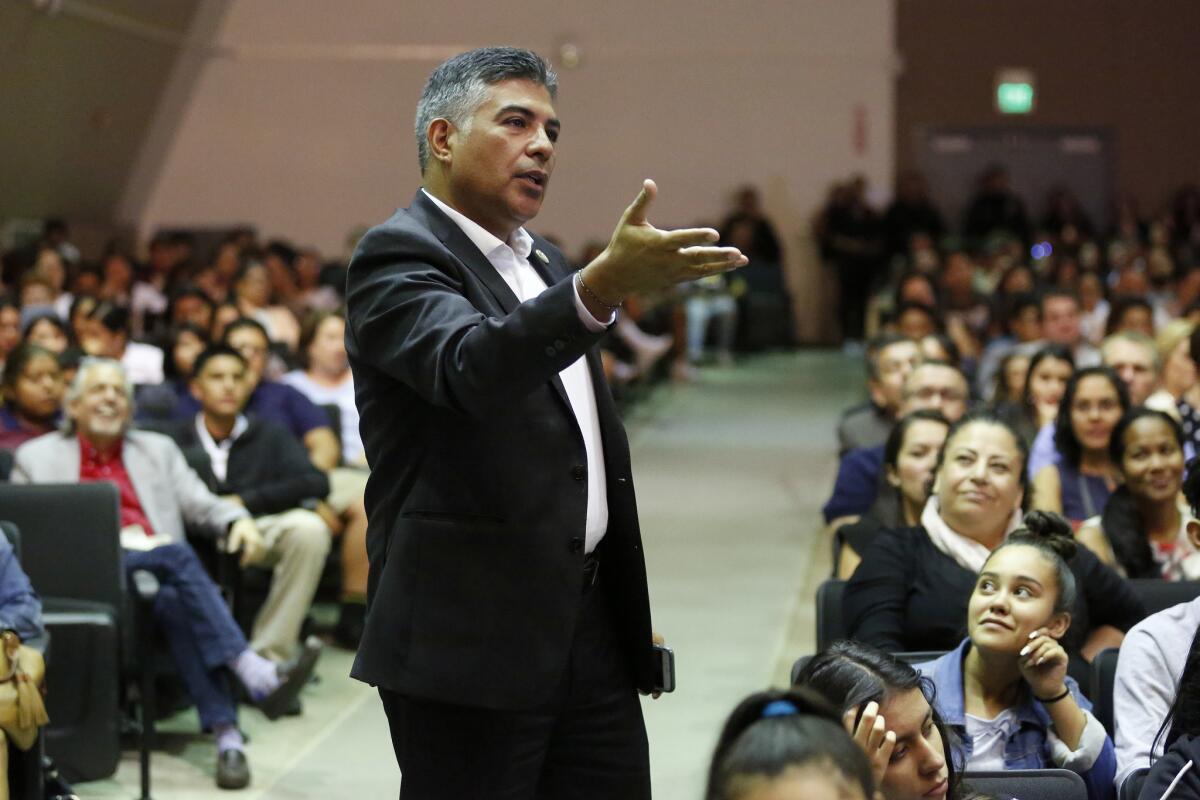 Rep. Tony Cárdenas asks a question of Lin-Manuel Miranda during a town hall at Panorama High School in Panorama City.