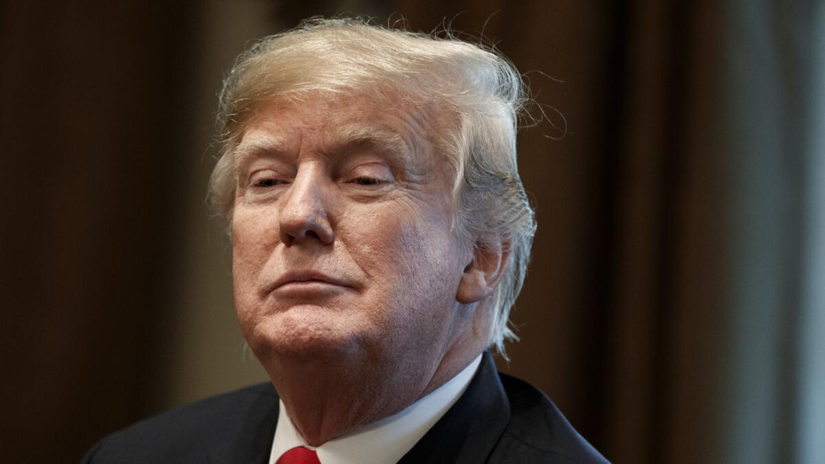 President Trump listens during a meeting in the Cabinet Room of the White House in Washington earlier this month.