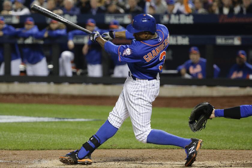 New York Mets outfielder Curtis Granderson (3) follows through on a double to centerfield, scoring three runs against the Dodgers during the second inning.