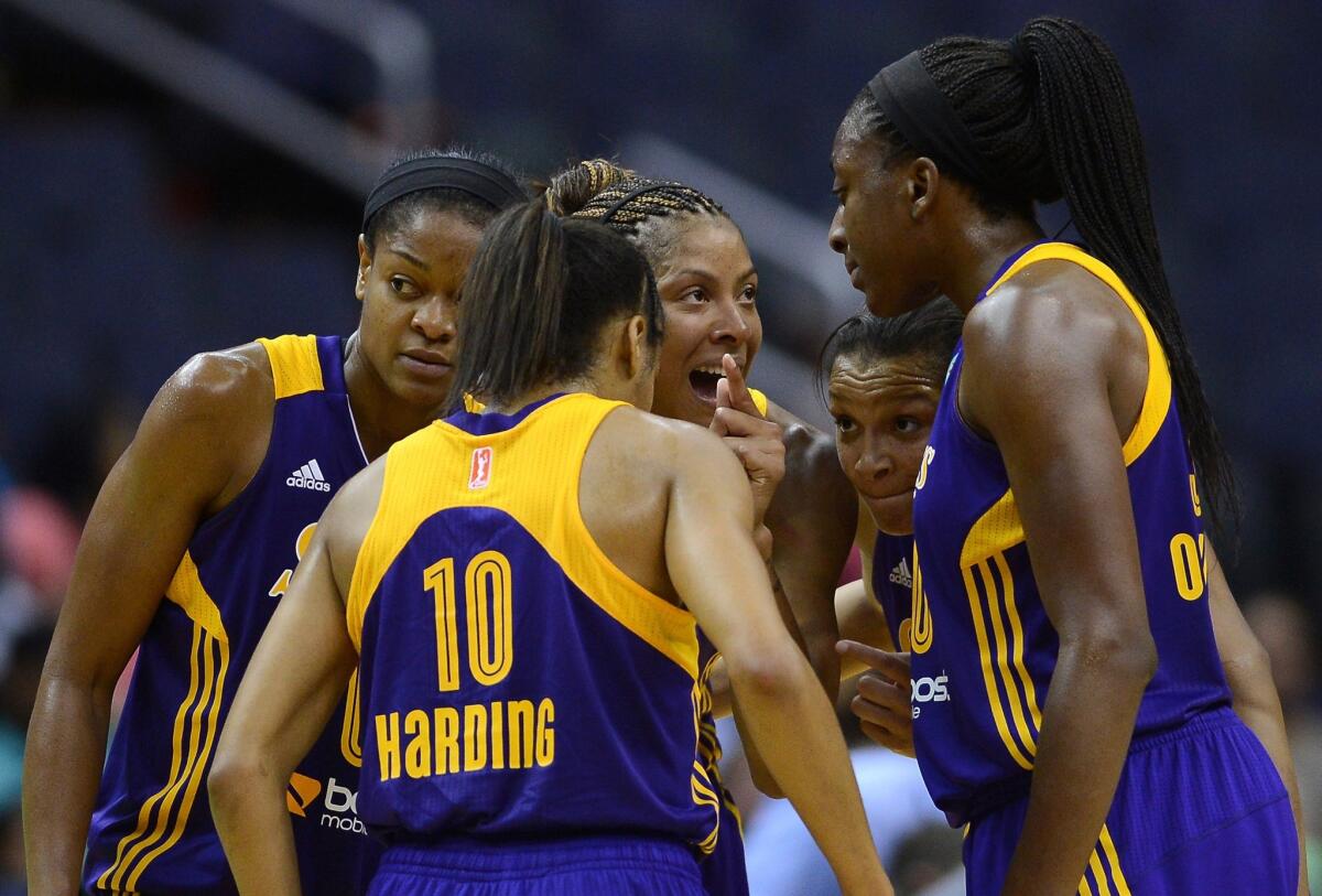 Candace Parker, center, gathers her teammates together during a game Sunday against the Washington Mystics.