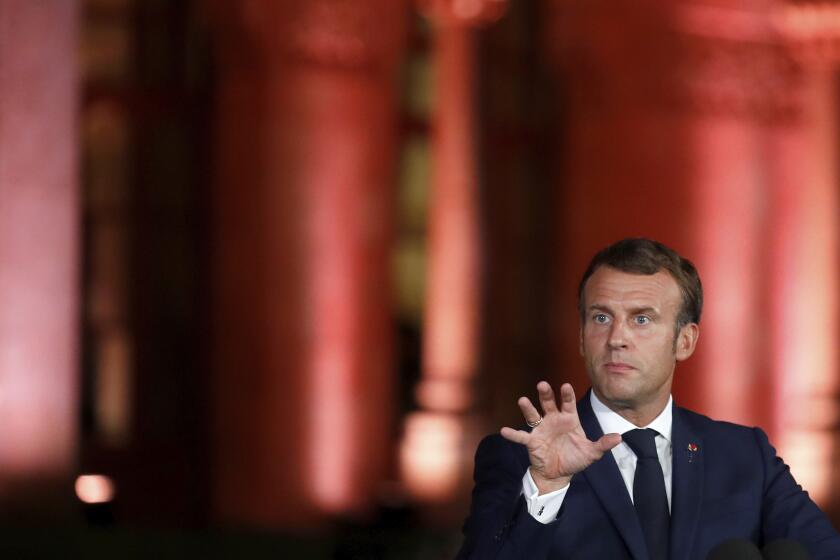 French President Emmanuel Macron attends a media conference in Beirut, Lebanon, Tuesday, Sept. 1, 2020. French President Emmanuel Macron issued a stern warning to Lebanon's political class, urging them to commit to serious reforms within few months or risk punitive action including sanctions, if they fail to deliver. (Gonzalo Fuentes/Pool via AP)