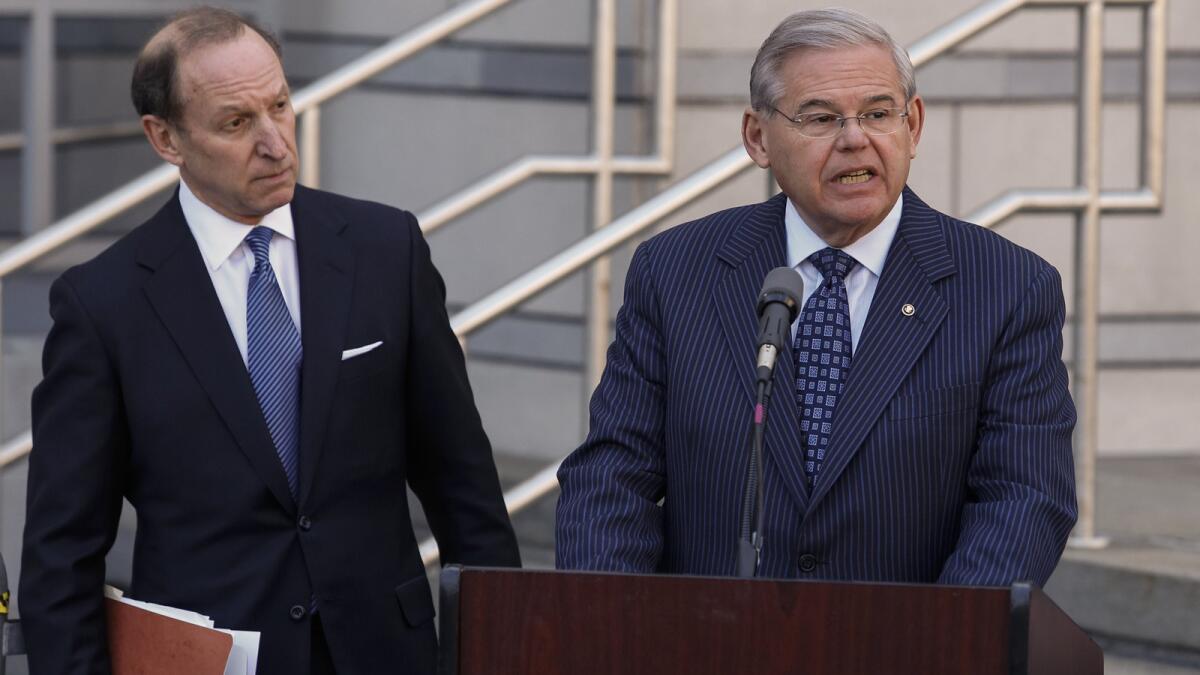 U.S. Sen. Robert Menendez, with attorney Abbe Lowell, speaks outside federal court in Newark, N.J., after his arraignment. He will have difficulty fighting the “false statements” felony charge over failing to report gifts.
