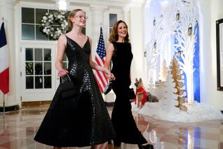 Jennifer Garner arrives with daughter Violet Affleck, both in black gowns, at a White House dinner on Dec. 1, 2022