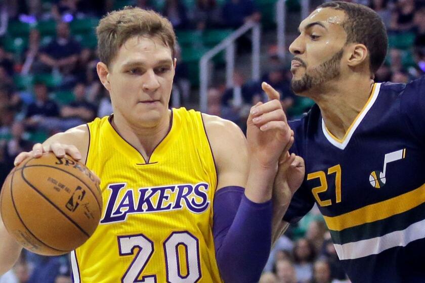 The Lakers' Timofey Mozgov tries to get past Utah's Rudy Gobert on Oct. 28.