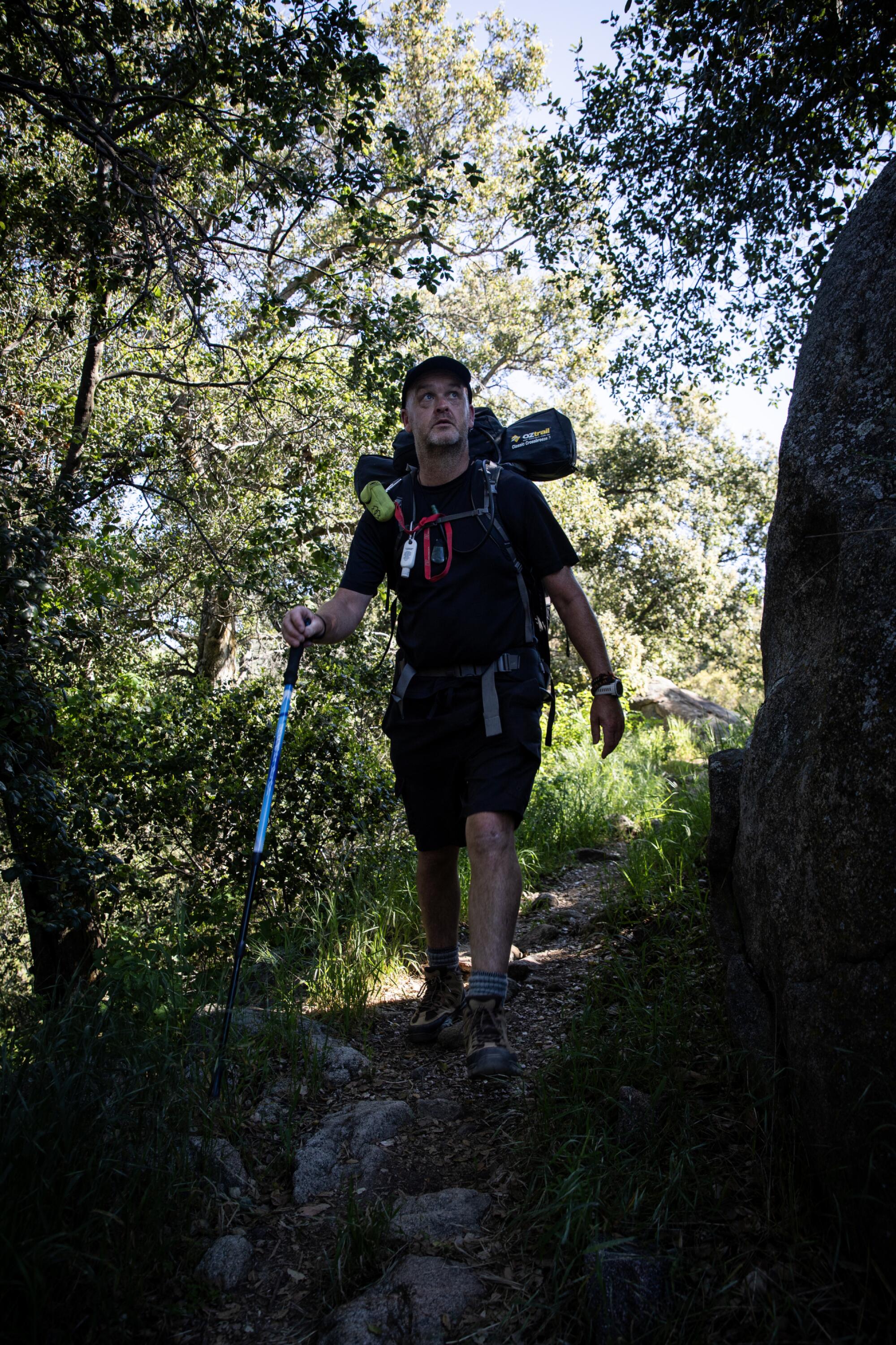 Mike Brown, 52, of New Zealand, hikes the Pacific Crest Trail on Saturday, April 20, 2024 in Campo, California. 